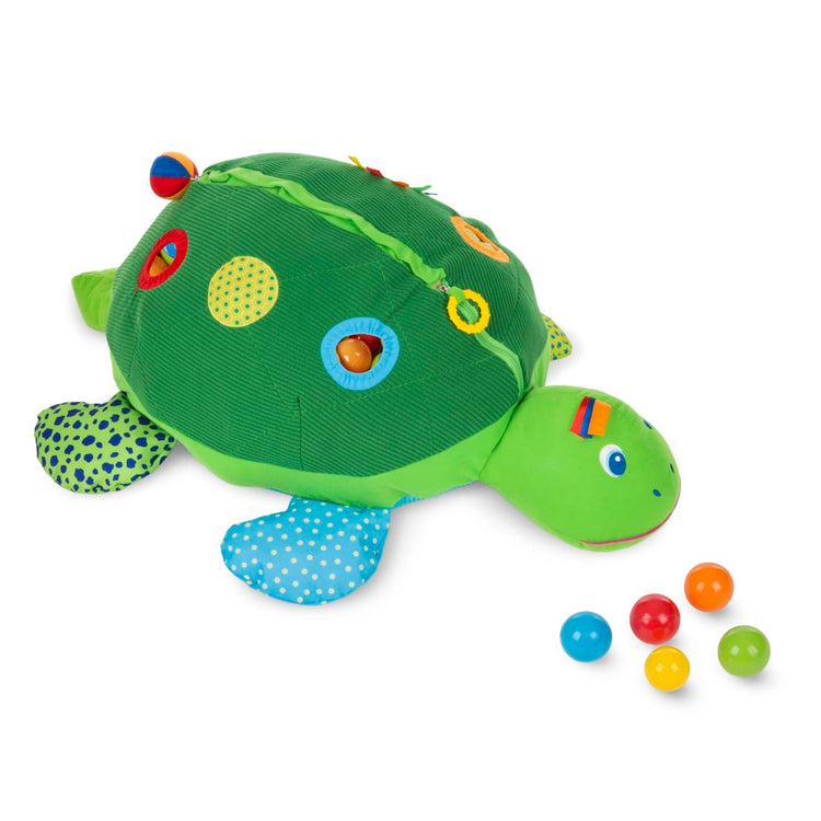The loose pieces of the Melissa & Doug K's Kids Turtle Ball Pit With 60 Balls