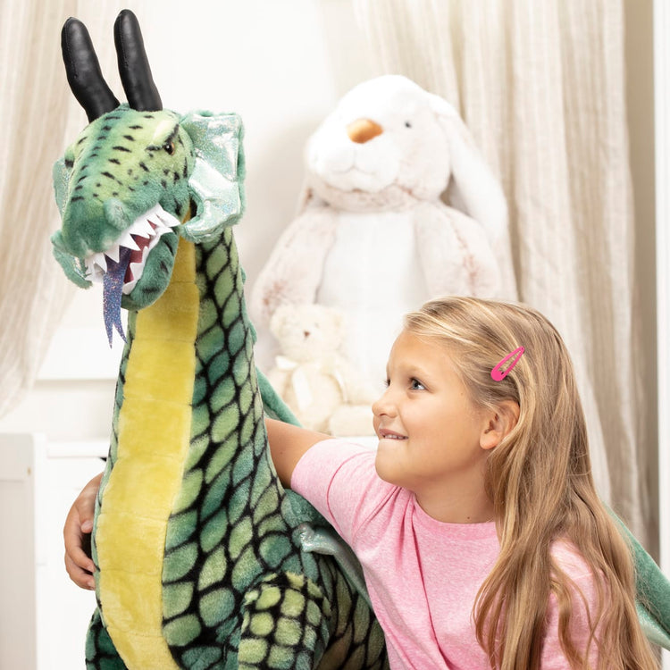 The front of the box for the Melissa & Doug Lifelike Plush Giant Winged Dragon Stuffed Animal (36 x 40.5 x 16 in)
