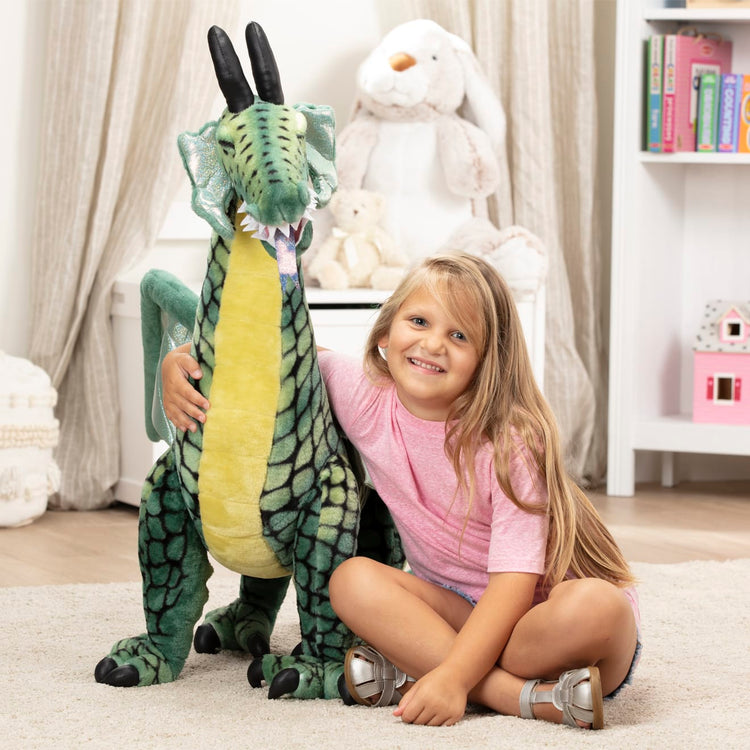 The front of the box for the Melissa & Doug Lifelike Plush Giant Winged Dragon Stuffed Animal (36 x 40.5 x 16 in)
