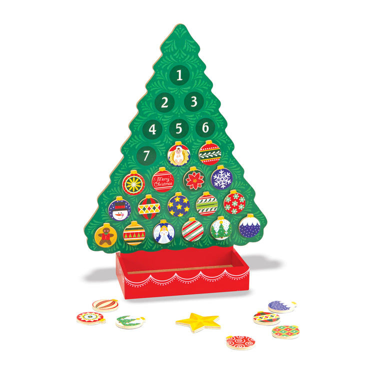 The loose pieces of the Melissa & Doug Wooden Religious Advent Calendar - Magnetic Christmas Tree, 25 Magnets