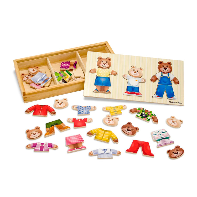 The loose pieces of the Melissa & Doug Mix 'n Match Wooden Bear Family Dress-Up Puzzle With Storage Case (45 pcs)