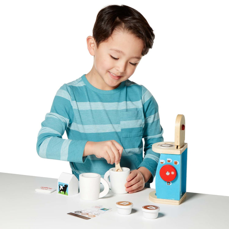 A child on white background with the Melissa & Doug 11-Piece Brew and Serve Wooden Coffee Maker Set - Play Kitchen Accessories