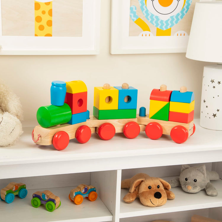 the Melissa & Doug Wooden Jumbo Stacking Train – 4-Color Classic Wooden Toddler Toy (17 pcs)