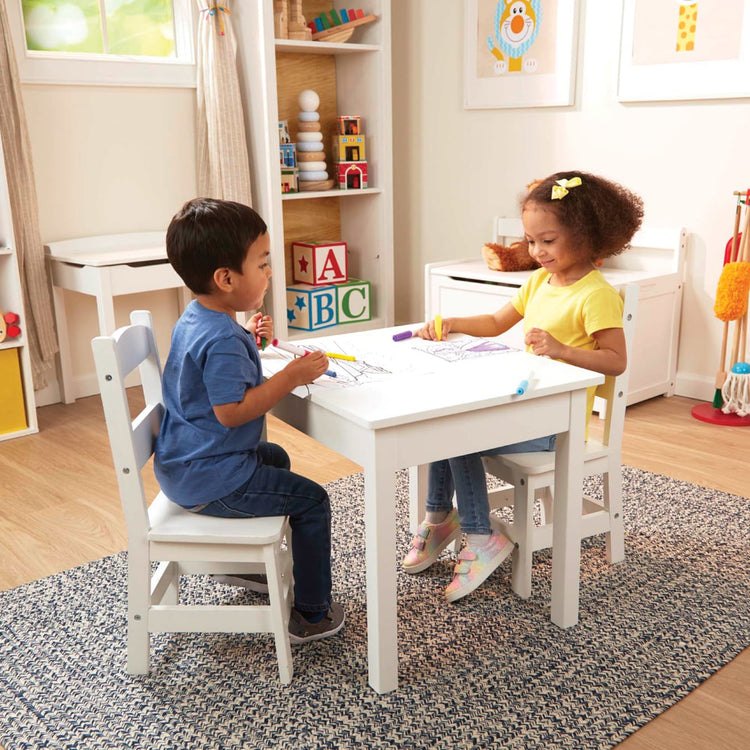 https://www.melissaanddoug.com/cdn/shop/products/Wooden-Table-Chairs-White-030225-1-Kid-Lifestyle.jpg?v=1664912591&width=750
