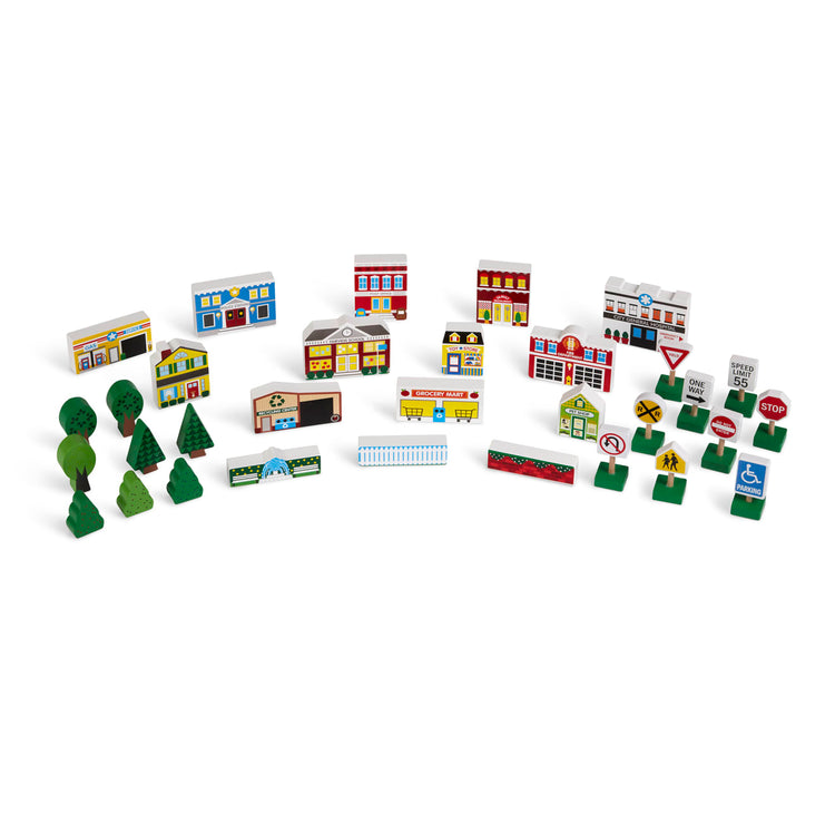 The loose pieces of the Melissa & Doug Wooden Town Play Set With Storage Tray (32 pcs)