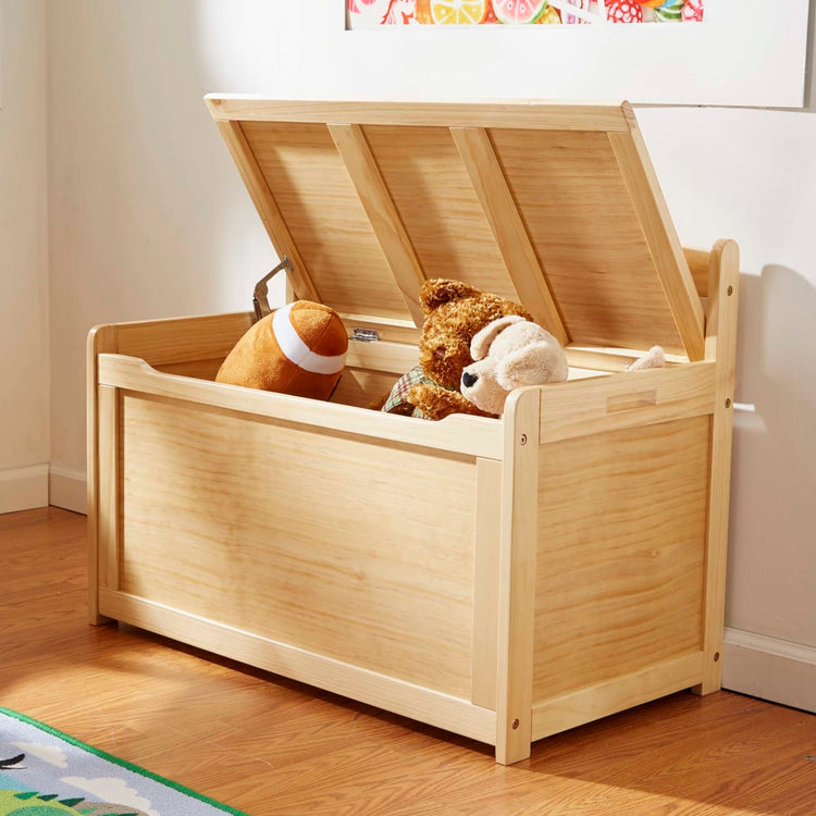 A kid playing with the Melissa & Doug Wooden Toy Chest (Honey)